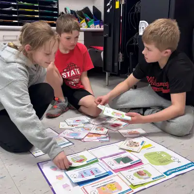 image of three students working together